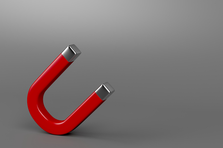 Red horseshoe magnet on gray backgroundの写真素材