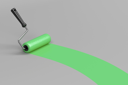 Painting with green paint on grey backgroundの写真素材