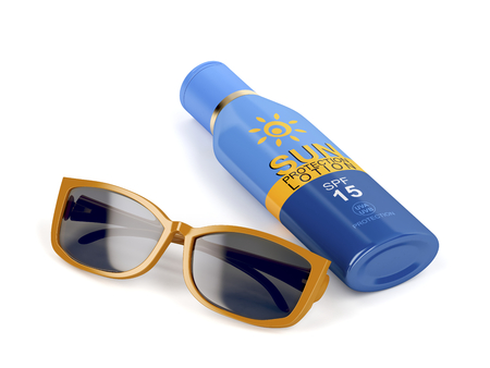 Female sunglasses and sunscreen bottle on white backgroundの写真素材