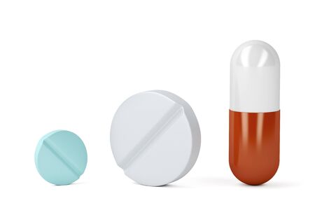 Pills and a capsule on white backgroundの写真素材