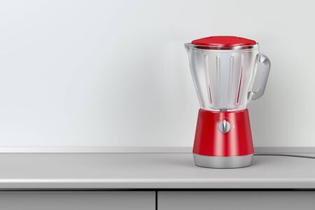 Red electric blender in the kitchenの写真素材