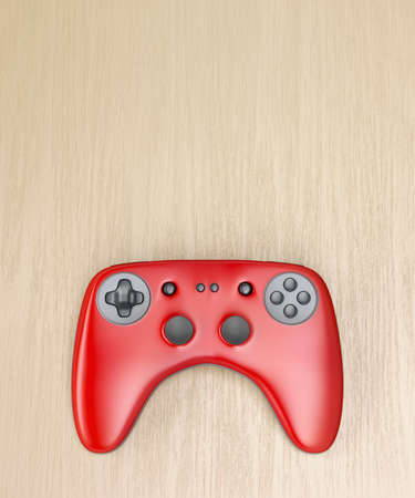 Red wireless gamepad on wooden desk, top view