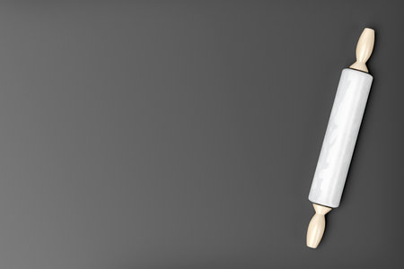 Marble rolling pin on the grey table, top viewの写真素材