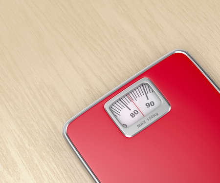 Mechanical weighing scale on wooden floor, close up