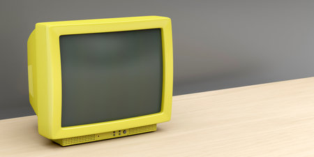 Yellow retro tv on wooden standの写真素材