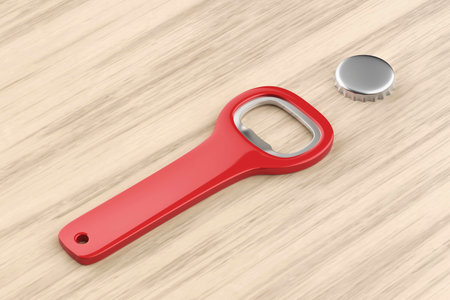 Silver beer cap and red bottle opener on wooden tableの写真素材