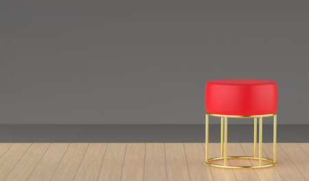 Red leather stool with golden legs in the roomの写真素材