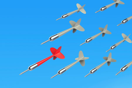 Concept image with many flying darts against blue sky, red dart on the front