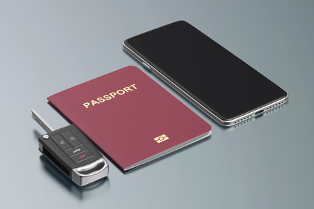 Smartphone, passport and car key on shiny metal deskの写真素材