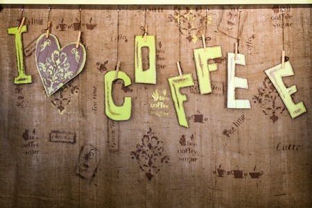 i love coffee words on natural burlap texture. Handmade sign board for cafe or restaurant with free space for your textの写真素材