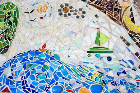 mosaic on the wall made of broken colored tilesの写真素材