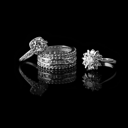 Luxury jewellery. White gold or silver rings with diamonds. Selective focus.の写真素材