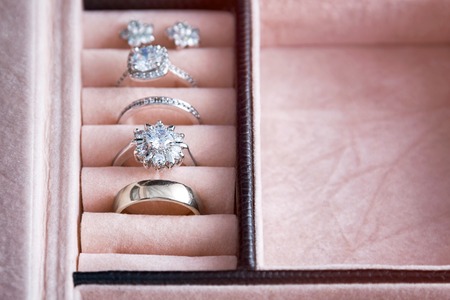 Jewelry box with white gold and silver rings. Collection of luxury jewelry