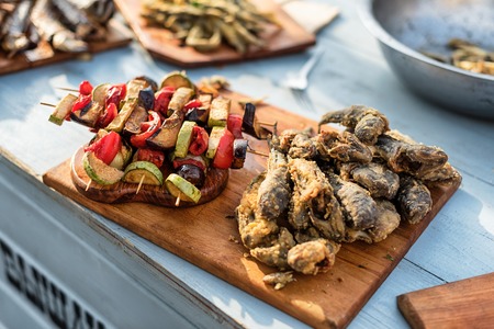 Grilled Vegetable Skewers and fish. Street food festival