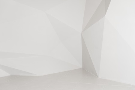 White geometric polygonal background. Walls in studioの写真素材