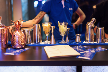 Barman show. Bartender is making cocktail at night clubの写真素材