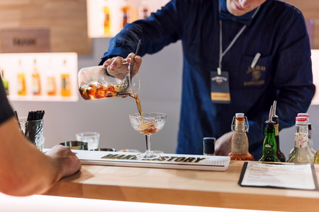 KIEV, UKRAINE - 30 OCTOBER, 2016: Barman festival. Young handsome bartender is making cocktailのeditorial素材