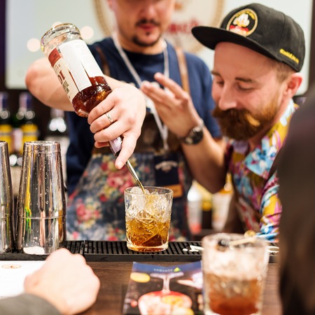 Kyiv, Ukraine - 30 october, 2016: Barman festival. Young handsome bartenders are making cocktailのeditorial素材
