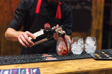 KIEV, UKRAINE - 30 OCTOBER, 2016: Barman festival. Young handsome bartender is making cocktail.のeditorial素材