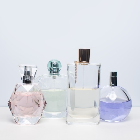 Different perfume bottles on white background. Perfumery, cosmetics.の写真素材