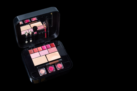 Make up case with cosmetics isolated on black. Fashion woman still life. Free space for textの写真素材