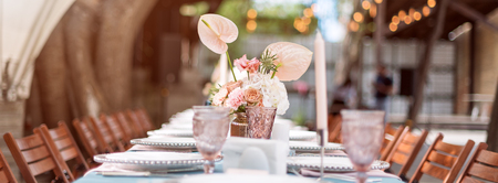 Flower table decorations for holidays and wedding dinner. Table set for holiday, event, party or...