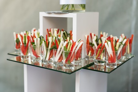 Appetizer of fresh cucumbers, asparagus and pepper, party finger food.の写真素材