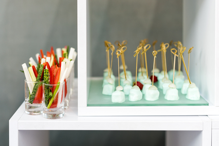Appetizer of fresh cucumbers, asparagus and pepper, party finger food.の写真素材