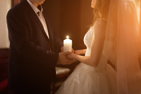 Newly married couple in hotel room, romance wedding night.の写真素材