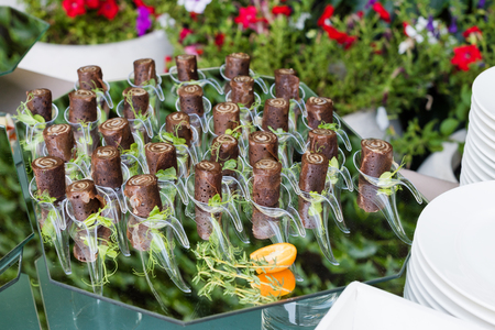 Appetizers, finger food, party food, sliders. Canape, tapas. Served table at summer terrace cafe. Catering service. Outdoor restaurant table with food.の写真素材