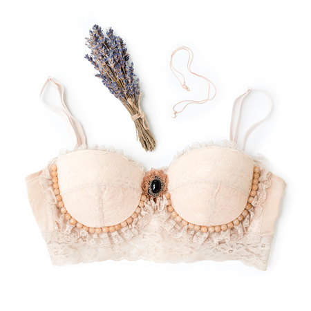 Glamorous stylish sexy lace lingerie with woman accessories on white background. Woman lace bra with perfume, flat lay, top view. Shopping and fashion concept, textile, underwear.の写真素材