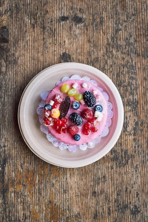 Sweet cheese cake with fresh berries and yoghurt cream. Delicious raspberry cake with fresh...