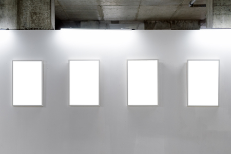 Mock up. Blank picture frames on white wall. Gallery wall with empty frames indoor.の写真素材