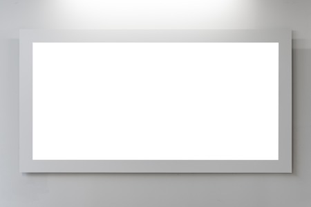 Mock up. Blank picture frame on white wall. Gallery wall with empty frame indoor.の写真素材