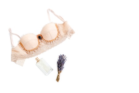 Glamorous stylish sexy lace lingerie with woman accessories on white background. Woman lace bra with perfume, flat lay, top view. Shopping and fashion concept, textile, jewelry, underwearの写真素材