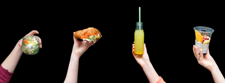 Hands holding healthy food, menu with microgreens. Vegetarian sandwiches with micro greens assortment. Vegan party, organic vegetables, drink, salad and dessert. Healthy lifestyle and eating right concept, copyspace.の写真素材