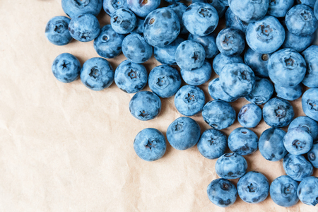 Fresh blueberry on craft paper background. Blueberries texture close up.の写真素材