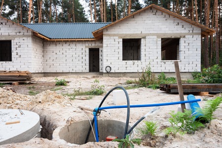 Building a house. Unfinished brick house in progressの写真素材