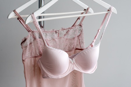 Vareity of bra hanging on a hanger. Textile, Underwear. Female bra in lingerie underwear store. Advertise, sale, fashion concept.の写真素材