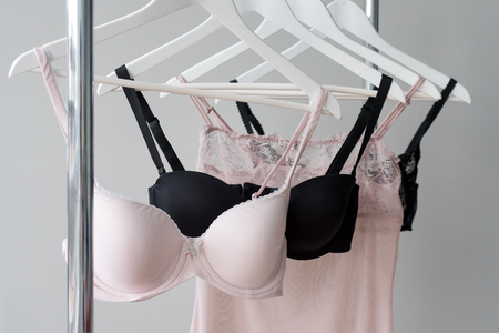 Vareity of bra hanging on a hanger. Textile, Underwear. Female bra in lingerie underwear store. Advertise, sale, fashion concept.の写真素材