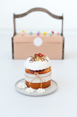 Easter cake. Orthodox sweet bread, kulich, traditional food on light background. Gifts for holiday...