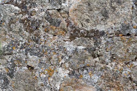 Texture of a stone wall. Old castle stone wall background. Wall made of wild stone. Natural...