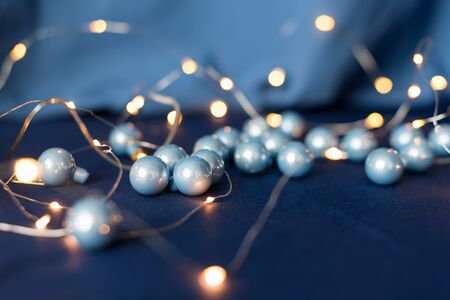 Christmas tree baubles with garland. Happy Winter Holidays theme. Christmas greetings background.の写真素材