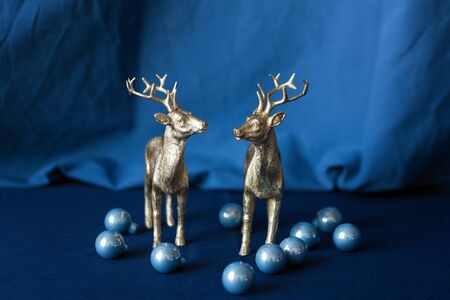 Christmas reindeers with Christmas decorations. Beautiful golden reindeer toys, Santa helpers decoration, Christmas tree bauble. New Year conceptの写真素材