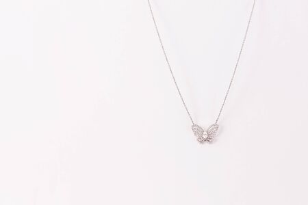 Luxury white golden pendant with diamonds with free space for text.の写真素材