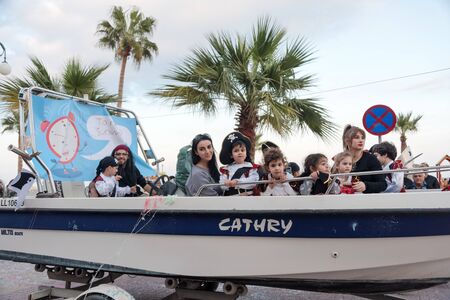 LIMASSOL, CYPRUS - MARCH 9, 2019: Grand carnival parade, people in costumes at famous traditional...
