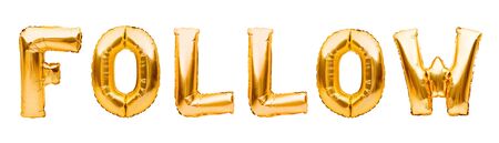 Word FOLLOW made of golden inflatable balloons isolated on white background. Helium balloons gold foil forming word follow. Social media, communication conceptの写真素材