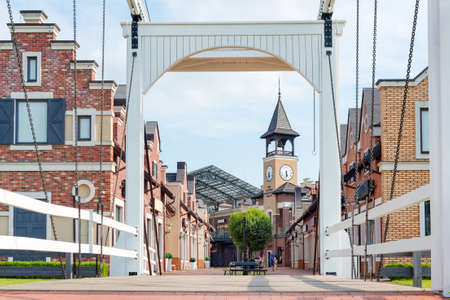 Pedestrian street in small european city. Old town in Europe, view on city center from the bridge.の写真素材
