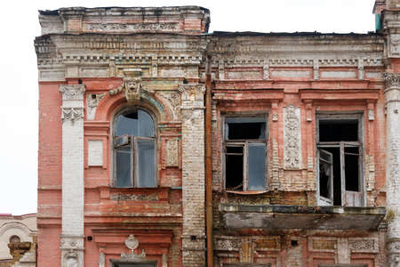 Old destroyed and abandoned ruin building. Vintage damaged house requiring repair.