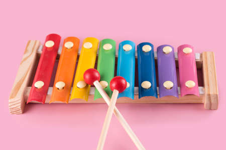Xylophone for kids, infant wooden musical instrument toy for toddlers. Colorful xylophone with metal keys and wooden beaters.の写真素材